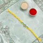 Elegant Yellow Thread Floral Design Rakhi with Roli Chawal