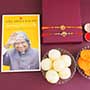Two Golden Rakhis with Sweets N Book