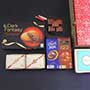 Golden Rakhi N Designer Rakhi with Chocolates Gift Hamper