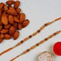 Golden Red Thread Rakhi And Almonds