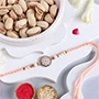 Rosy American Diamond Rakhi N Pistachio Combo