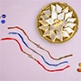 Astonishing Designer Rakhi Set with Kaju Katli