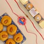 Rudraksh & Kids Set of 2 Rakhis With Besan Laddoo & Ferrero Rocher