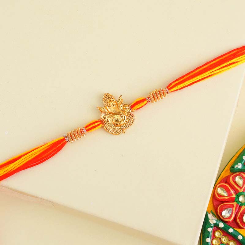 Large Rakhi Send 1 Golden Ganesha Rakhi N 2 Beaded Rakhi Japan Online | Rakhibazaar.com