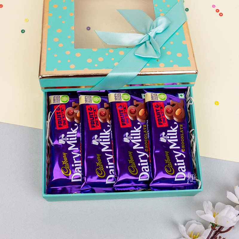 Send Designer Rakhi with a Combo of Dairy Milk Chocolate Online