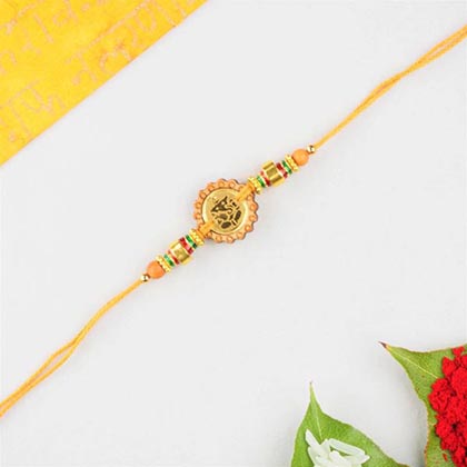 Ganesha rakhi in round fancy wood work