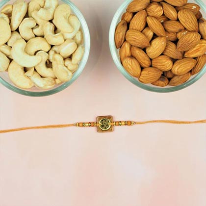 Aum Wooden Art Rakhi With Dry Fruits