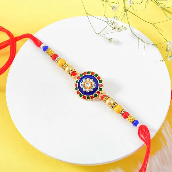 Traditional Colourful floral Rakhi with Dryfruits and Besan Laddu