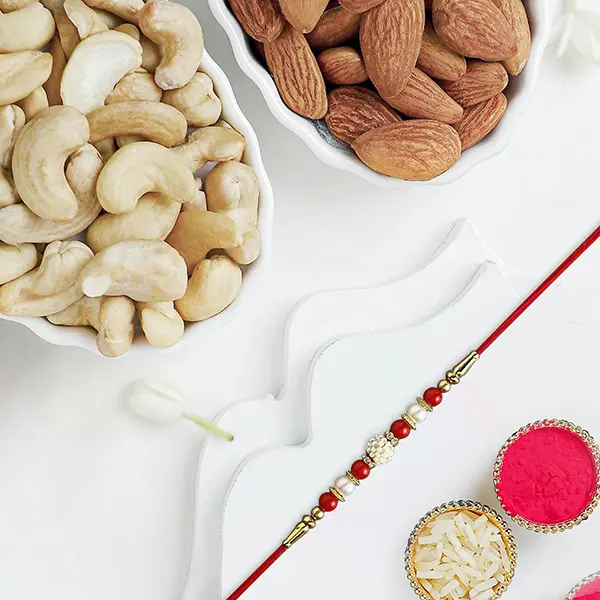 Luminescent Luster Pearl Rakhi With Almonds N Cashew