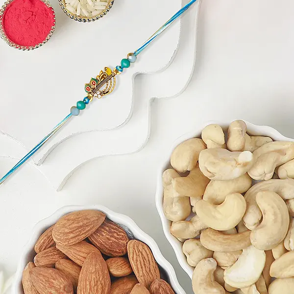 Melodic Krishna Flute Rakhi With Almonds and Cashew