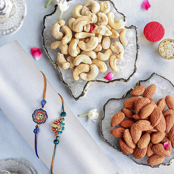 Vibrant Ganesh and Om Rakhi Duo With Almonds and Cashew