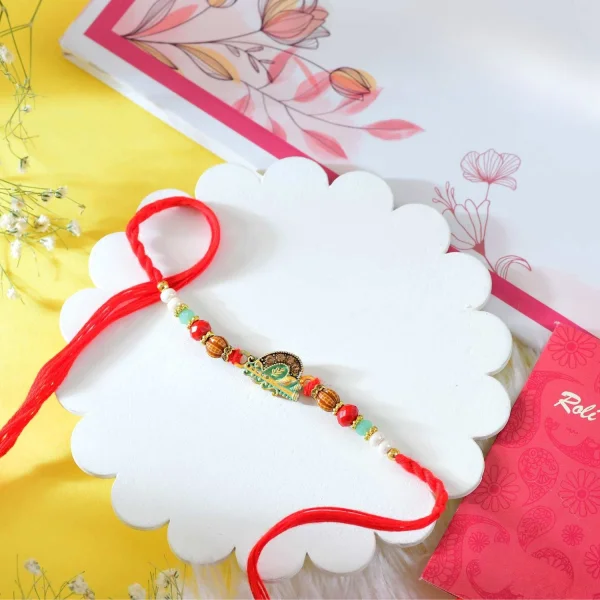 Krishna Bansuri Rakhi Gift Combo with Besan Laddoo