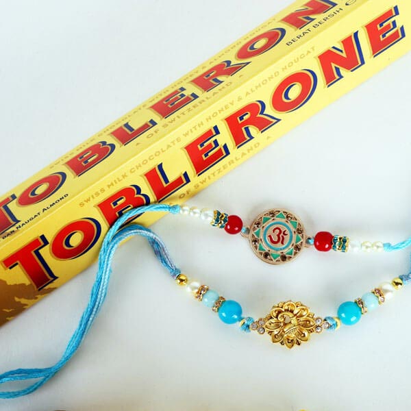 Om & Peacock Rakhis with Toblerone