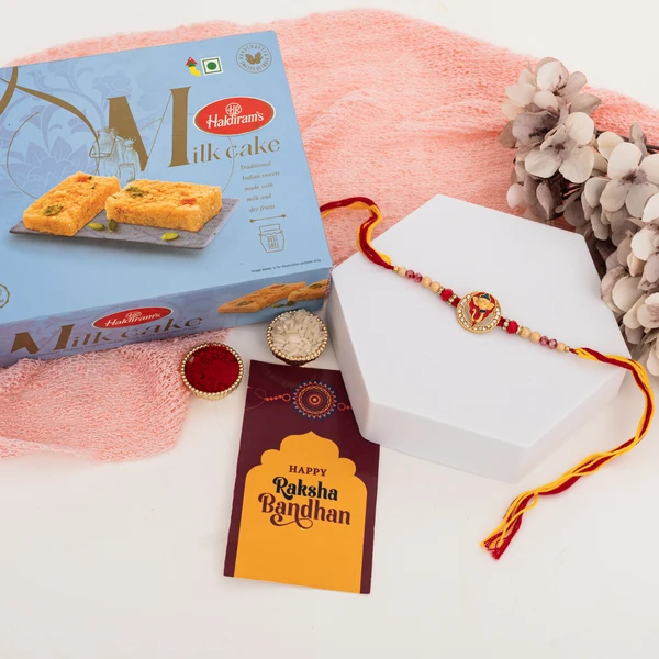 Premium AD Ganesha Rakhi with Milk Cake