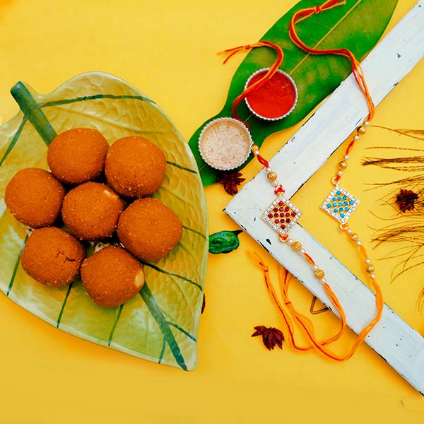 Send Siblings Traditional Rakhi Pair With Besan Laddu Online ...