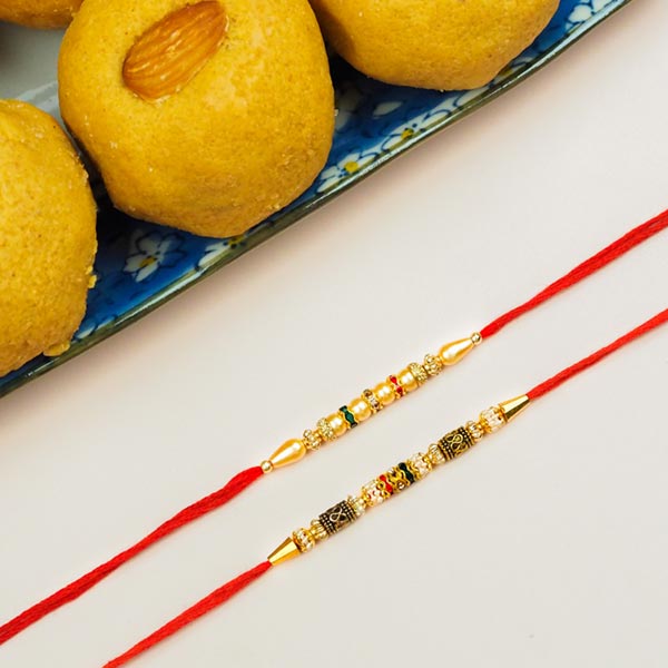 Collection Of 2 Pearl Rakhis With Besan Laddoo