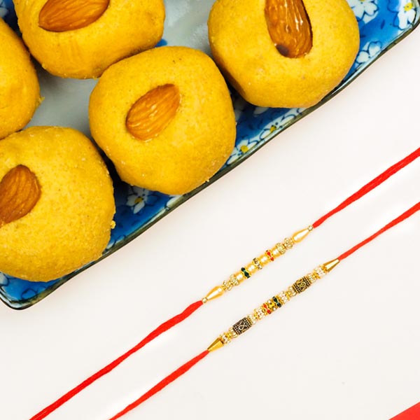 Collection Of 2 Pearl Rakhis With Besan Laddoo