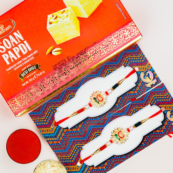 Collection Of 2 Ek Onkar Rakhis With Soan Papdi