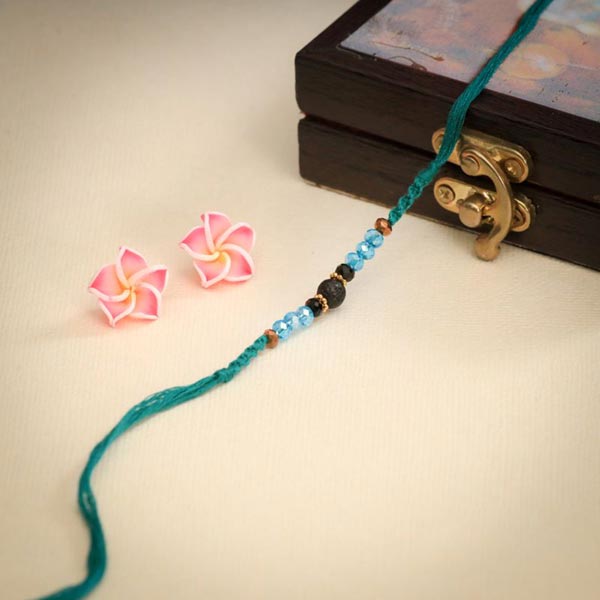 Lava Stone Rakhi in Blue Thread