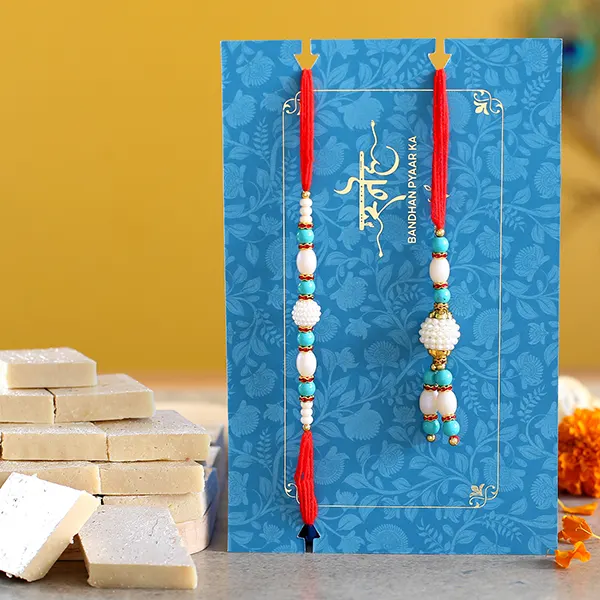 Blue Pearl And Lumba Rakhi Set With 340 Gms Kaju Katli - For Qatar