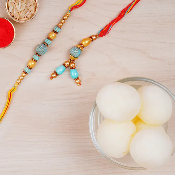 Blue Stone Rakhi Set And Haldiram Rasgulla Tin Combo - For Qatar