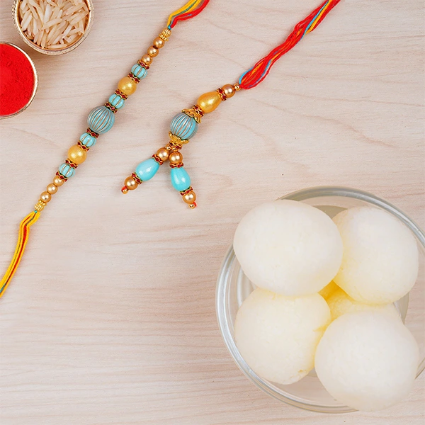 Blue Stone Rakhi Set And Haldiram Rasgulla Tin Combo