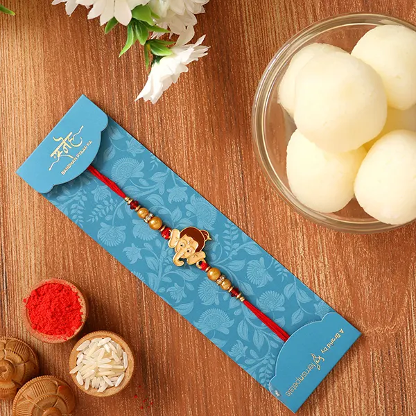 Ganesha Face Kids Rakhi And Rasgulla Exp - For Qatar