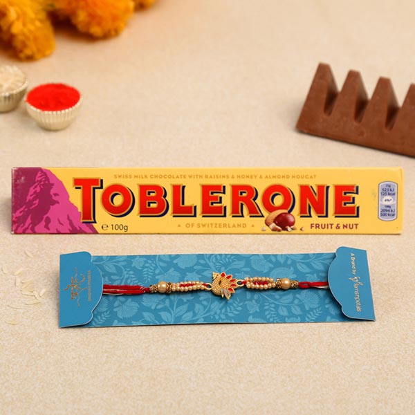 Red Peacock Designer Rakhi And Toblerone Chocolate