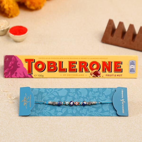 Auspicious Evil Eye Designer Rakhi And Toblerone Chocolate