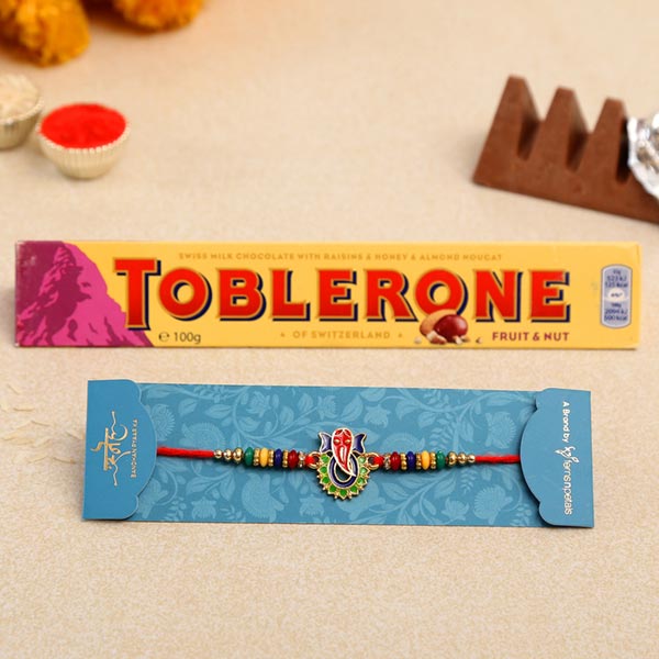 Multicoloured Lord Ganesha Rakhi And Toblerone Chocolate
