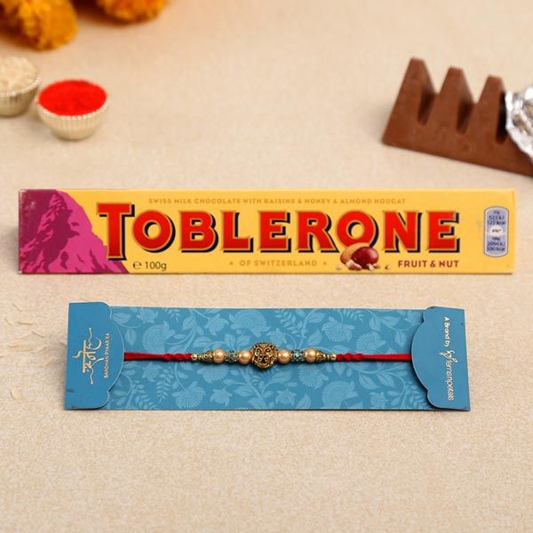 Lion Face Pearl Rakhi And Toblerone Chocolate