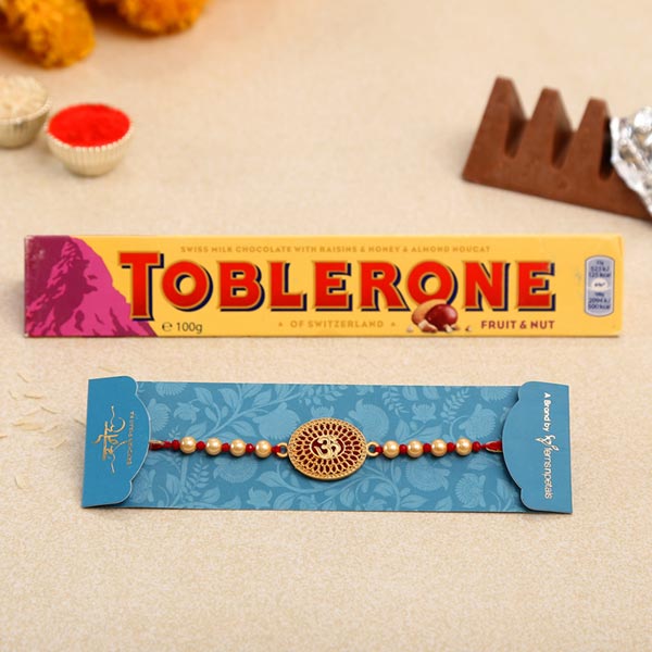 Spiritual Om Pearl Rakhi And Toblerone Chocolate