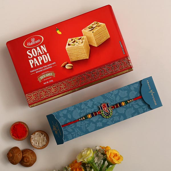 Multicoloured Lord Ganesha Rakhi And Soan Papdi