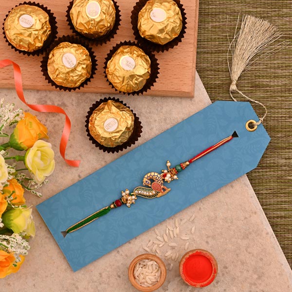 Beautiful Peacock Designer Rakhi And 3 Pcs Ferrero Rocher