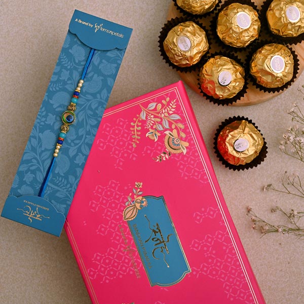 Circular Peacock Feather Rakhi And 3 Pcs Ferrero Rocher