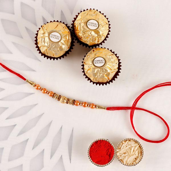 Sneh Rose Gold Rakhi & Ferrero Rocher to Qatar