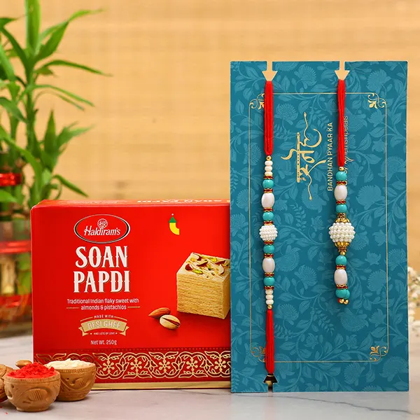 Blue Pearl And Lumba Rakhi Set With 250 Gms Soan Papdi - For Qatar