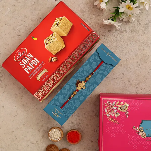 Long Trunk Bal Ganesha Pearl Rakhi For Kids With 250 Gms Soan Papdi - For Qatar