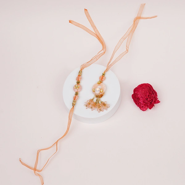 Elegant Peach Thread Bhaiya Bhabhi Lumba Rakhi Set