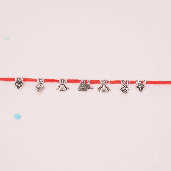 Elegant Red Cotton Rakhi with Dangling Silver Charms