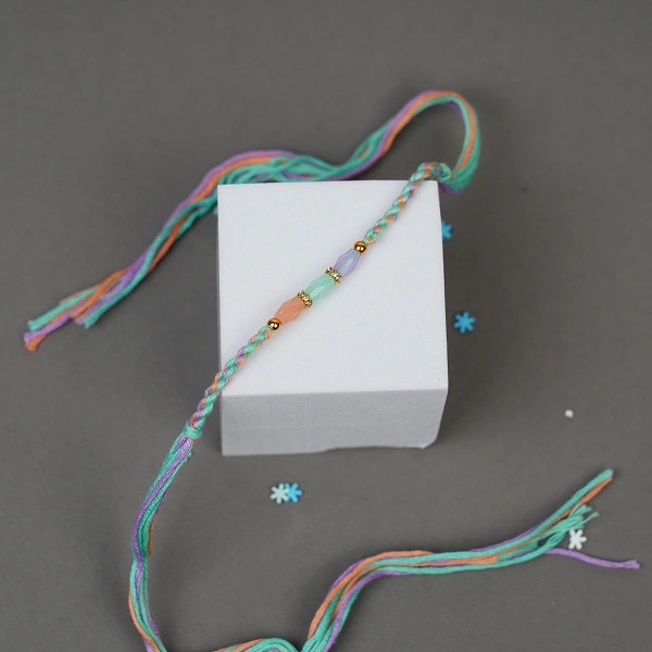 Traditional Multicolor Beaded Rakhi Gift Set with Dairy Milk Fruit & Nuts