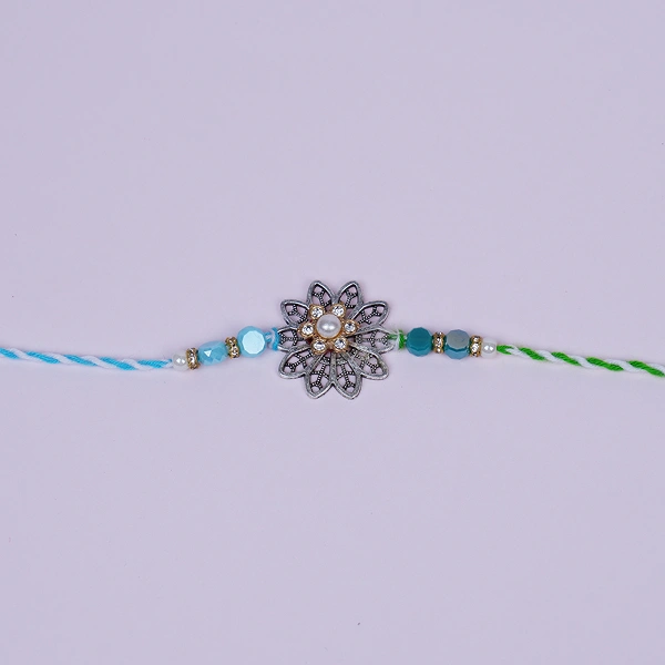 Vintage Silver Floral Rakhi with Blue Beads