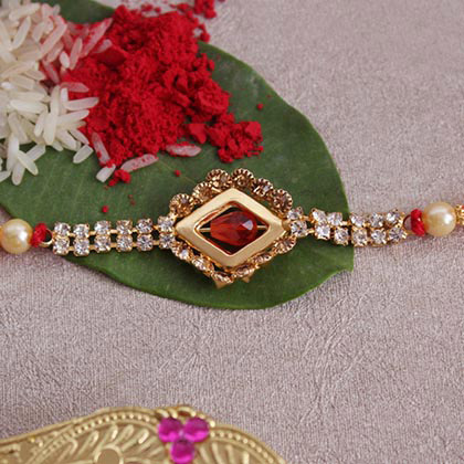 Beautiful Stone Studded Golden Rakhi