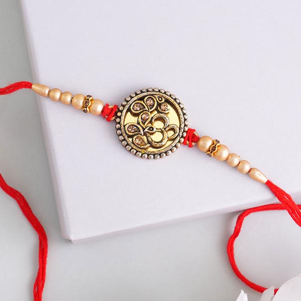 Eye-catchy golden Rakhi set of 3
