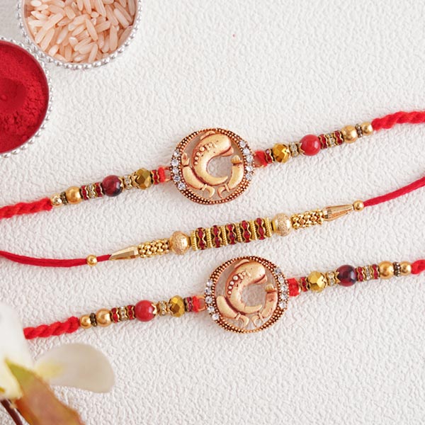 Splendid set of 3 divine golden Rakhi