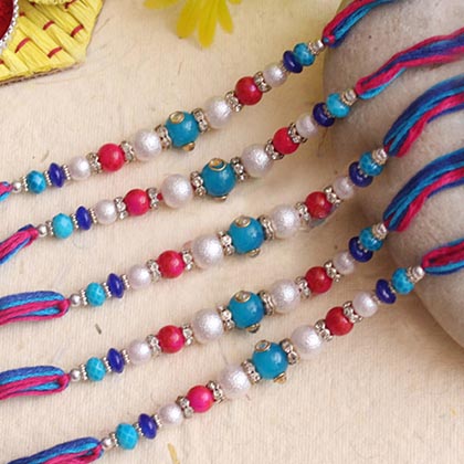 Gorgeous pearls stone Rakhi set of 5