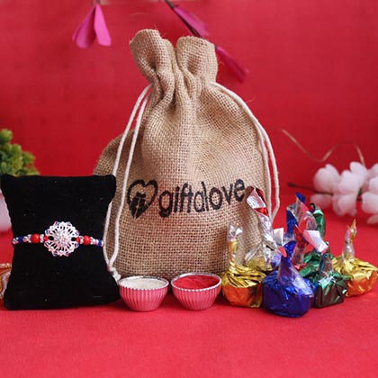 Silver Rakhi with Chocolate Potli