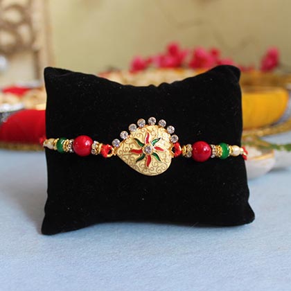 Golden Rakhi with Healthy Surprises