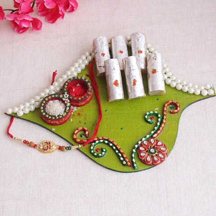 Captivating Om Rakhi with Sweets: & Thali