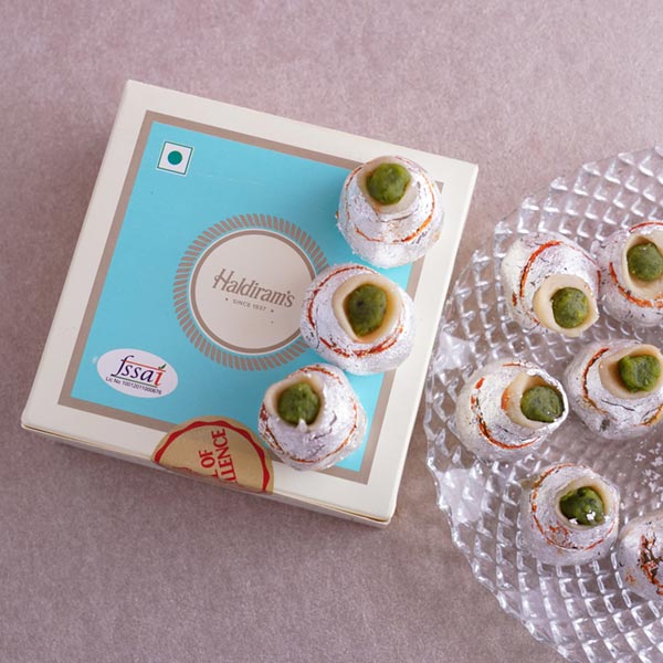 Scintillating Pearl Rakhi with Kaju Kalash Sweets